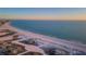 Expansive aerial view of the Gulf Coast's sandy beach and tranquil turquoise waters at 11595 Gulf Blvd # 6, Treasure Island, FL 33706