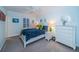 Inviting bedroom features a queen size bed with tropical themed decorations, and ceiling fan at 11595 Gulf Blvd # 6, Treasure Island, FL 33706