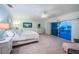 Bedroom with view of balcony, and plenty of room with carpet and chair at 11595 Gulf Blvd # 6, Treasure Island, FL 33706