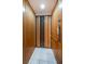 An elevator with accordion doors provides easy access to all levels of the home at 11595 Gulf Blvd # 6, Treasure Island, FL 33706