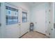Bright entryway with tiled floors and glass paneled doors looking out at the home's exterior at 11595 Gulf Blvd # 6, Treasure Island, FL 33706
