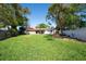 Large backyard with a well maintained lawn, patio and fence at 11980 Valencia Ct, Seminole, FL 33772