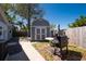 Backyard featuring large shed, a grill and patio set at 11980 Valencia Ct, Seminole, FL 33772