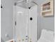 Clean bathroom featuring a walk-in shower, toilet, and built-in shelves for a functional space at 11980 Valencia Ct, Seminole, FL 33772