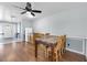 Bright dining room with a table, wooden flooring, a ceiling fan and a breakfast nook at 11980 Valencia Ct, Seminole, FL 33772
