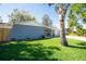 Exterior front of the home featuring a lawn with mature landscaping at 11980 Valencia Ct, Seminole, FL 33772