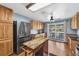 Bright kitchen with modern appliances, a breakfast bar, and an island, perfect for cooking at 11980 Valencia Ct, Seminole, FL 33772