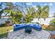 Backyard patio with comfortable seating around a fire pit, ideal for outdoor entertaining at 1269 80Th N Ave, St Petersburg, FL 33702