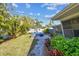 Lush backyard with a cozy patio and firepit, perfect for outdoor entertaining and relaxation at 1269 80Th N Ave, St Petersburg, FL 33702