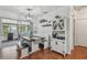 Bright dining area featuring built in benches, modern lighting and views to the exterior sun room at 1269 80Th N Ave, St Petersburg, FL 33702