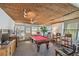 Bright game room featuring a billiards table, seating, and charming decor at 1269 80Th N Ave, St Petersburg, FL 33702