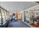 Bright game room featuring an exercise area, large sliding glass doors, and neutral tones at 1269 80Th N Ave, St Petersburg, FL 33702