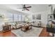 Bright living room featuring hardwood floors, plantation shutters, and neutral paint at 1269 80Th N Ave, St Petersburg, FL 33702