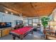 Sun room with pool table, television and seating for relaxing and entertaining at 1269 80Th N Ave, St Petersburg, FL 33702