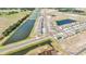 Aerial view of a residential area with ponds and newly constructed homes, reflecting modern community planning at 13162 Goldstone Ct, Wimauma, FL 33598