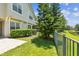 Landscaped backyard with view of pond at 14542 Mirabelle Vista Cir, Tampa, FL 33626