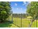 Backyard with fence and pond views at 14542 Mirabelle Vista Cir, Tampa, FL 33626