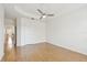 Bright bedroom featuring wood-look floors, ceiling fan, and neutral paint at 14542 Mirabelle Vista Cir, Tampa, FL 33626