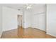 Bright bedroom featuring hardwood floors, ceiling fan, and closet at 14542 Mirabelle Vista Cir, Tampa, FL 33626