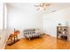 Comfortable spare bedroom with wood floors, a ceiling fan, and great natural light at 14542 Mirabelle Vista Cir, Tampa, FL 33626