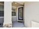 Welcoming entryway with a decorative glass door and stone accents at 14542 Mirabelle Vista Cir, Tampa, FL 33626