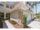 Beautiful townhome featuring stone accents, attached garage, and manicured landscaping at 14542 Mirabelle Vista Cir, Tampa, FL 33626