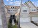 Charming multi-story home with a two-car garage, covered entry, and landscaped yard at 14542 Mirabelle Vista Cir, Tampa, FL 33626