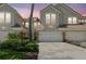 Townhome exterior with two car garage and garden at 14542 Mirabelle Vista Cir, Tampa, FL 33626