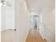 Upstairs hallway with light wood floors and access to the bedrooms at 14542 Mirabelle Vista Cir, Tampa, FL 33626