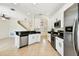 Open kitchen with dark countertops, stainless steel appliances, and white cabinets at 14542 Mirabelle Vista Cir, Tampa, FL 33626