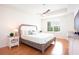 Inviting main bedroom with a ceiling fan, wood floors, and plenty of natural light at 14542 Mirabelle Vista Cir, Tampa, FL 33626