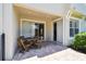 Covered patio with brick flooring and dining table at 14542 Mirabelle Vista Cir, Tampa, FL 33626