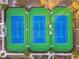 Overhead view of the community tennis courts and manicured landscaping at 14542 Mirabelle Vista Cir, Tampa, FL 33626
