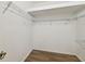 Walk-in closet features wood-look floors, white walls, and wire shelving at 14542 Mirabelle Vista Cir, Tampa, FL 33626