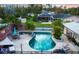 Pool and patio aerial showcasing its layout and connection to the backyard at 15099 Community Ave, Port Charlotte, FL 33953