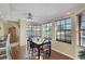 Bright dining area with large windows and wood flooring at 15099 Community Ave, Port Charlotte, FL 33953