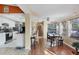 Open concept: Kitchen and dining room with natural light and wood floors at 15099 Community Ave, Port Charlotte, FL 33953