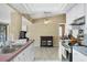 Well lit kitchen with stainless steel appliances and neutral tile flooring at 15099 Community Ave, Port Charlotte, FL 33953