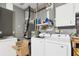 Functional laundry room with modern washer and dryer, and ample storage space at 15099 Community Ave, Port Charlotte, FL 33953