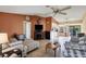 Open-concept living space with tile floors, a fireplace, and seamless transitions to dining and outdoor areas at 15099 Community Ave, Port Charlotte, FL 33953