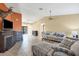 Bright and airy living room featuring a fireplace, tile floors, and an open layout for easy entertaining at 15099 Community Ave, Port Charlotte, FL 33953