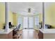 Inviting sitting room with bright, airy windows and comfortable office space at 15099 Community Ave, Port Charlotte, FL 33953