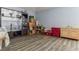Living room featuring hardwood-style floors and ample storage at 15425 Long Cypress Dr, Ruskin, FL 33573