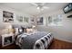 Bright bedroom with a large bed, decorative pillows, and natural light from windows at 1549 San Christopher Dr, Dunedin, FL 34698