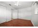 This bedroom has hardwood floors and a large closet at 1549 San Christopher Dr, Dunedin, FL 34698