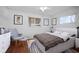 Serene bedroom with hardwood floors, stylish decor, and ample natural light at 1549 San Christopher Dr, Dunedin, FL 34698