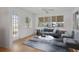 Cozy living room with large windows for natural light and stylish modern furniture at 1549 San Christopher Dr, Dunedin, FL 34698