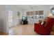 Comfortable living room featuring a recliner chair and large windows at 1549 San Christopher Dr, Dunedin, FL 34698