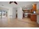 Open living room features tile floors and is near the kitchen and patio at 1549 San Christopher Dr, Dunedin, FL 34698