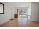 Open living room features tile floors and is near the patio at 1549 San Christopher Dr, Dunedin, FL 34698